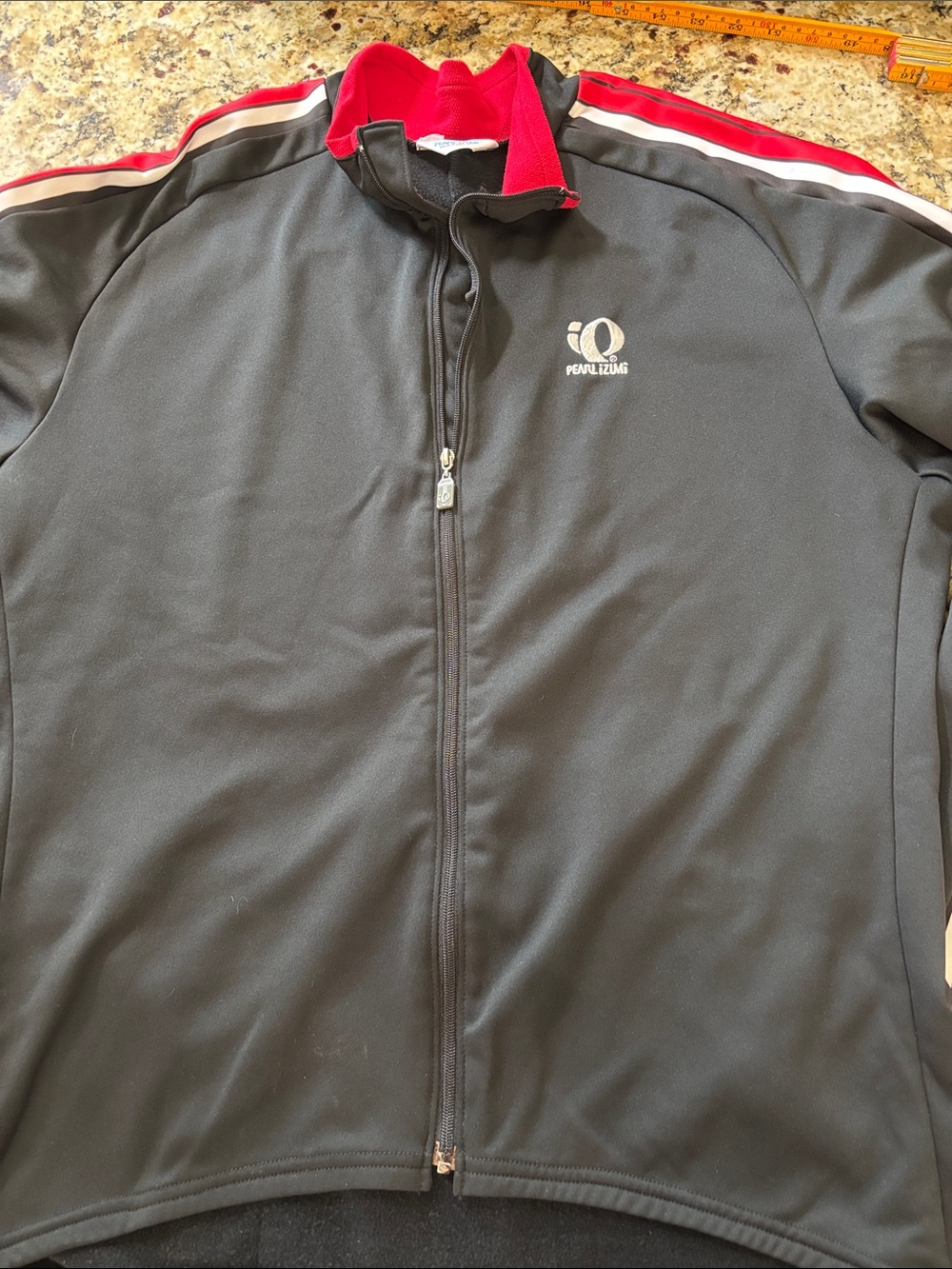 Pearl Izumi Black Jacket with Red and White Shoulder Stripes